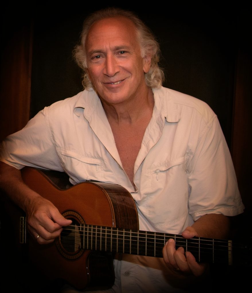 Len playing his guitar in Costa Rica.